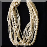 J08. Multistrand faux pearl necklace. 